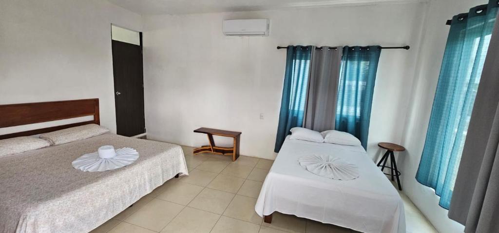 Postel nebo postele na pokoji v ubytování Hotel Miriam Bacalar