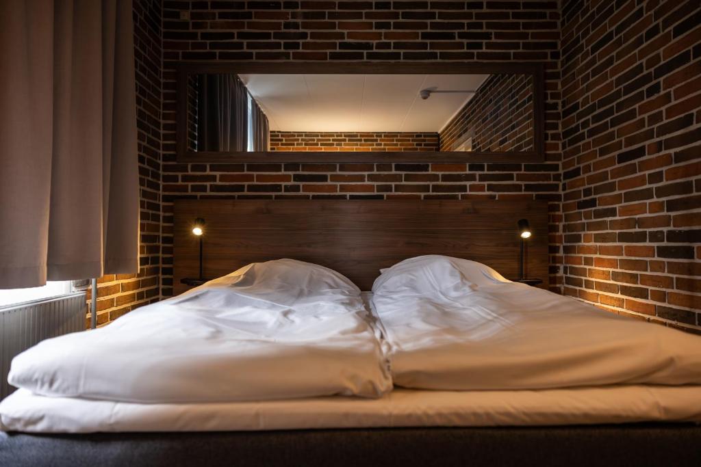 Voodi või voodid majutusasutuse Frederik VI's Hotel toas