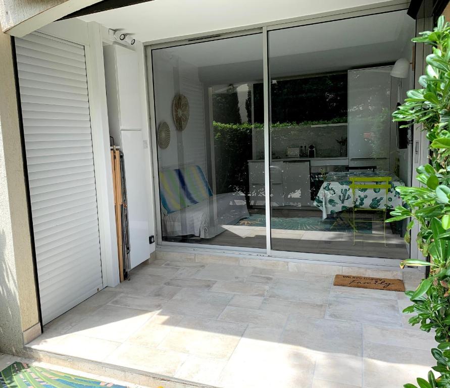 a sliding glass door with a view of a patio at Studio Argelès sur Mer in Argelès-sur-Mer