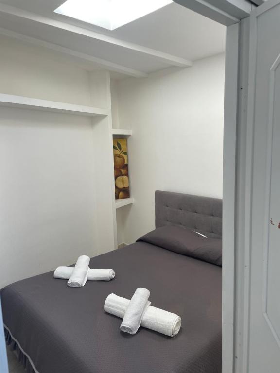 Postel nebo postele na pokoji v ubytování B&B Civitavecchia la casetta con giardino