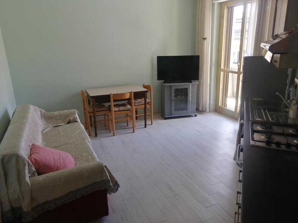 a living room with a couch and a table at La Casa di Teresa in Popoli