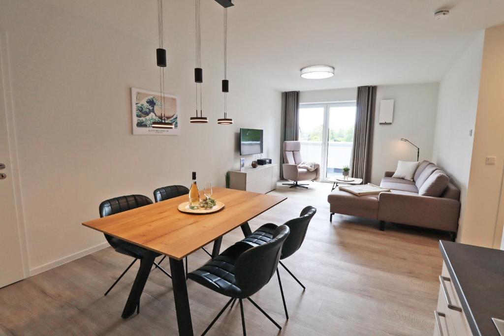 Χώρος καθιστικού στο KÜSTE33/44 - Neues Apartment mit Sauna in Strannähe