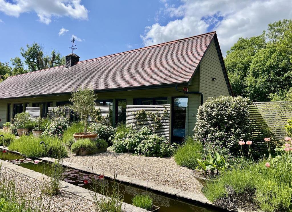 a house with a garden in front of it at Beauvoir Court Stables in Dorchester