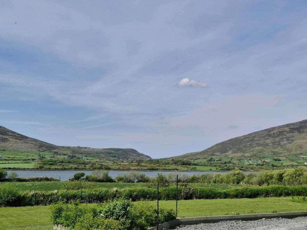 a view of a river with mountains in the background at Villa Rose - Sleeps 2 & Stunning Seaside Views in Cahersiveen