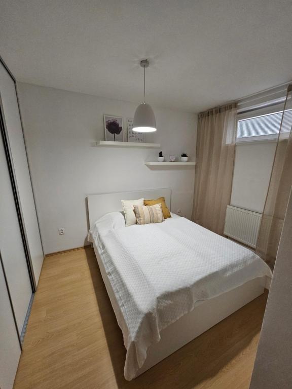 Postel nebo postele na pokoji v ubytování VB City Apartment