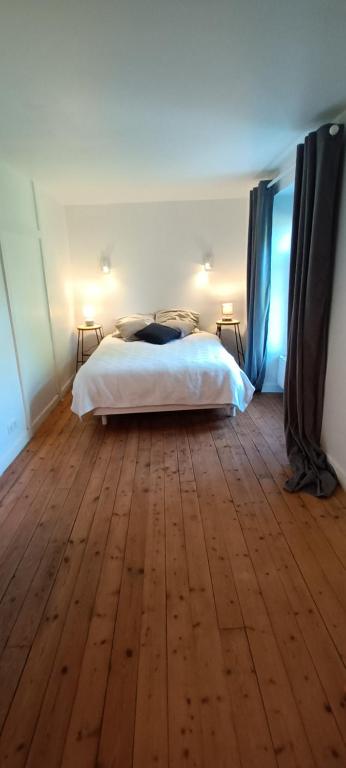 Postel nebo postele na pokoji v ubytování Gîte l'Echauguette du Perche