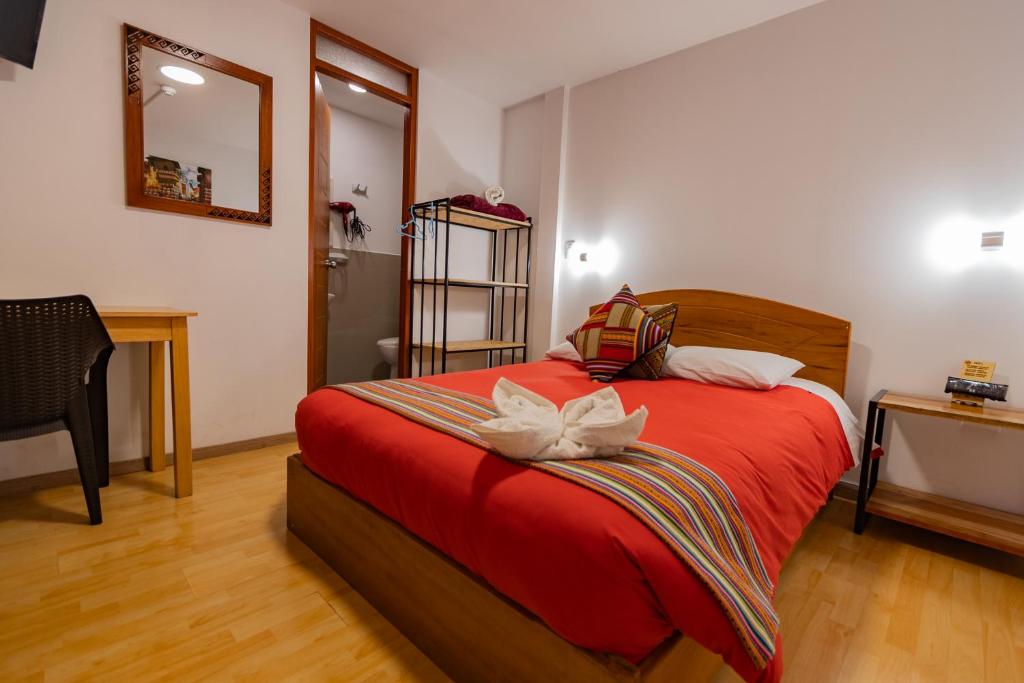 Postel nebo postele na pokoji v ubytování Andes House Cusco