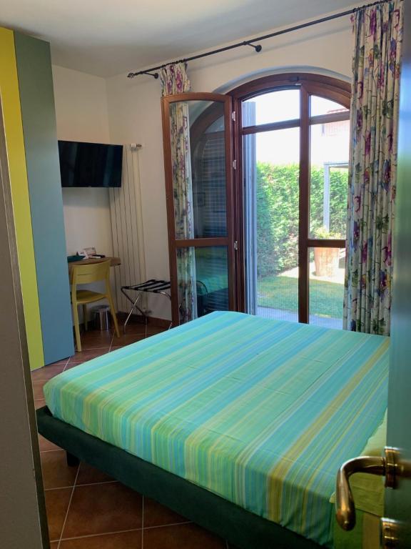 Łóżko lub łóżka w pokoju w obiekcie Casa Paola nel Chianti