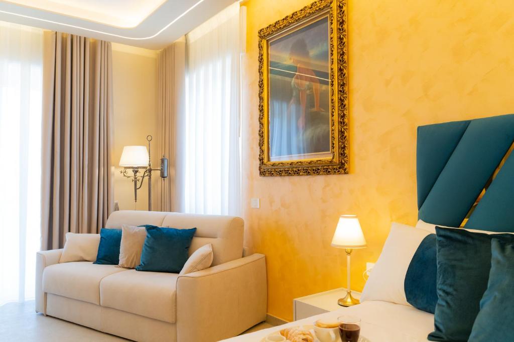 a living room with a couch and a chair at Partenope's House in Ercolano