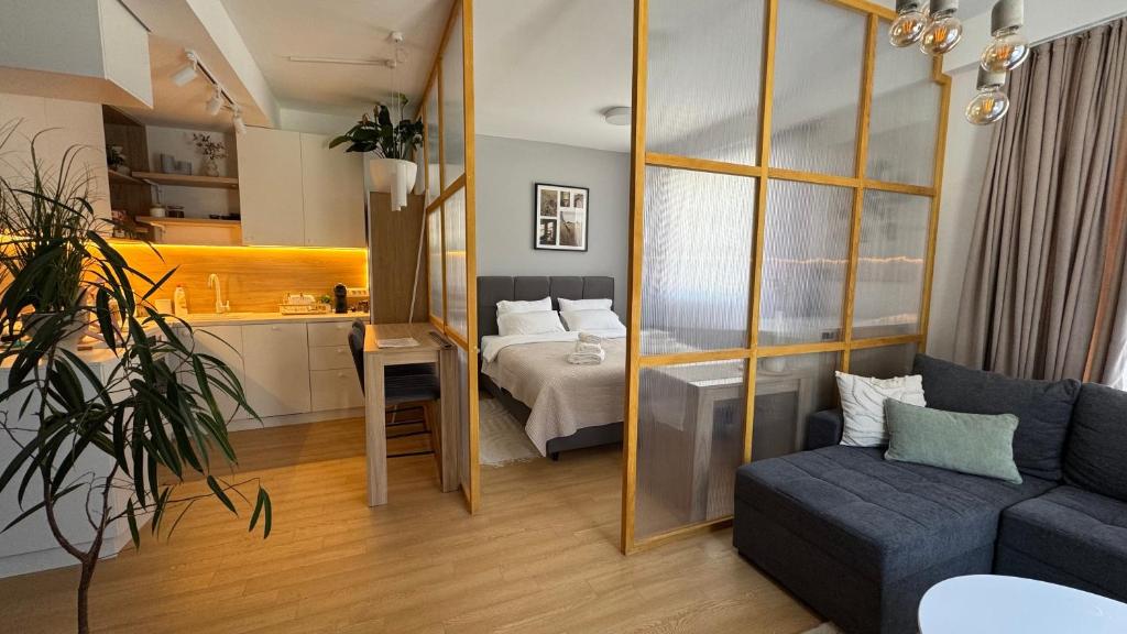 Postel nebo postele na pokoji v ubytování Kaneo Central Apartments