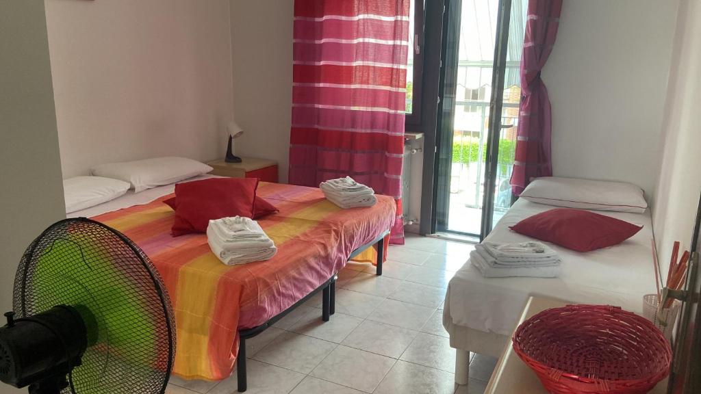 Postel nebo postele na pokoji v ubytování Guest House MICINI
