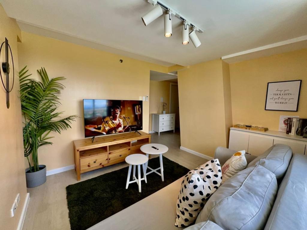 Beachfront · Private Beach Two Bedroom with Balcony by The Bali Corner at Azure North , POOL and BEACH VIEW - unit with Bathtub - Housity