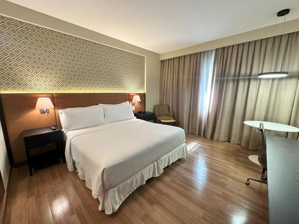 Postel nebo postele na pokoji v ubytování Wish Hotel da Bahia