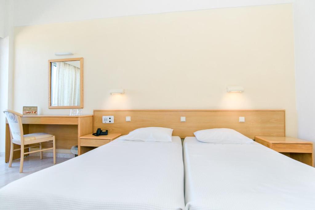 Postel nebo postele na pokoji v ubytování Hotel Riviera