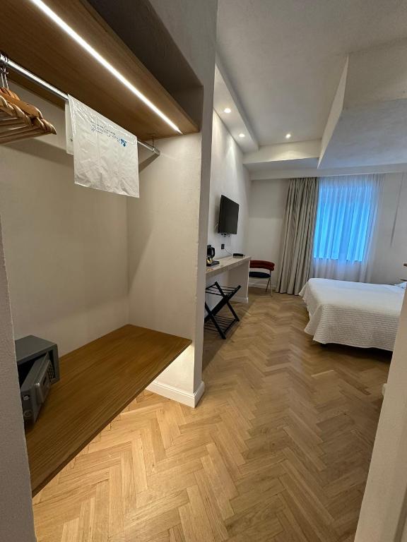 Postel nebo postele na pokoji v ubytování Punta Campanella Resort & Spa