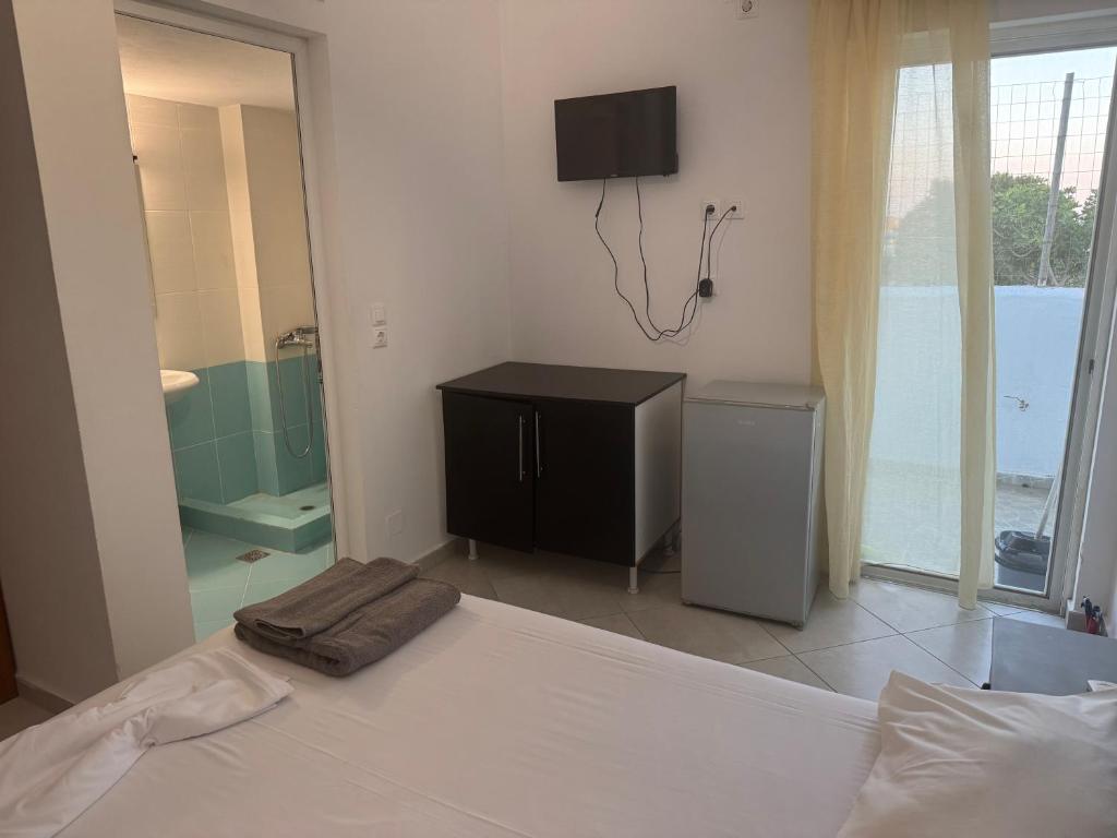 Postel nebo postele na pokoji v ubytování Petros rooms