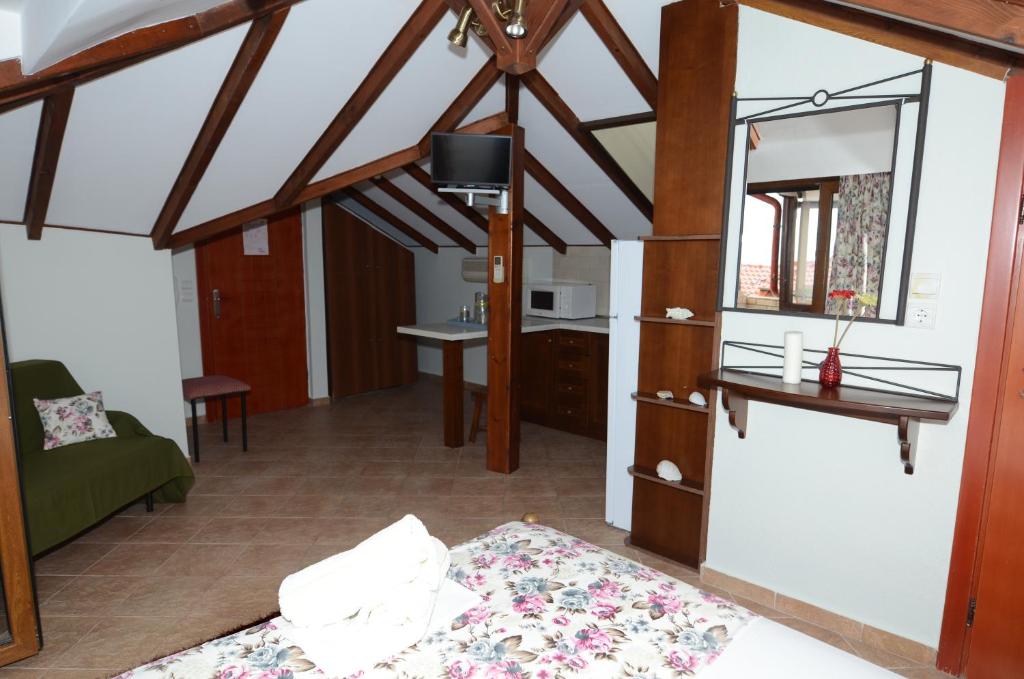 Postel nebo postele na pokoji v ubytování Nostos Rooms Ammouliani