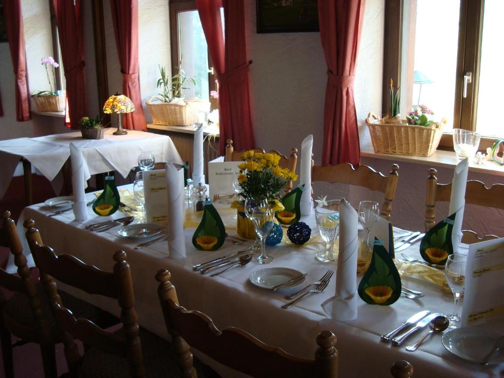 a table set up for a wedding with flowers and candles at Hotel-Restaurant Kohlenbacher-Hof in Waldkirch