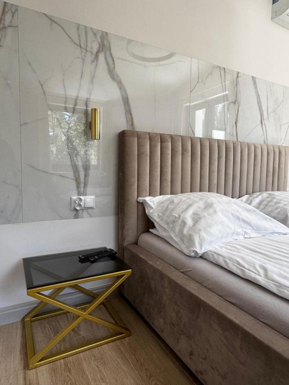 Posteľ alebo postele v izbe v ubytovaní Apartamenty
