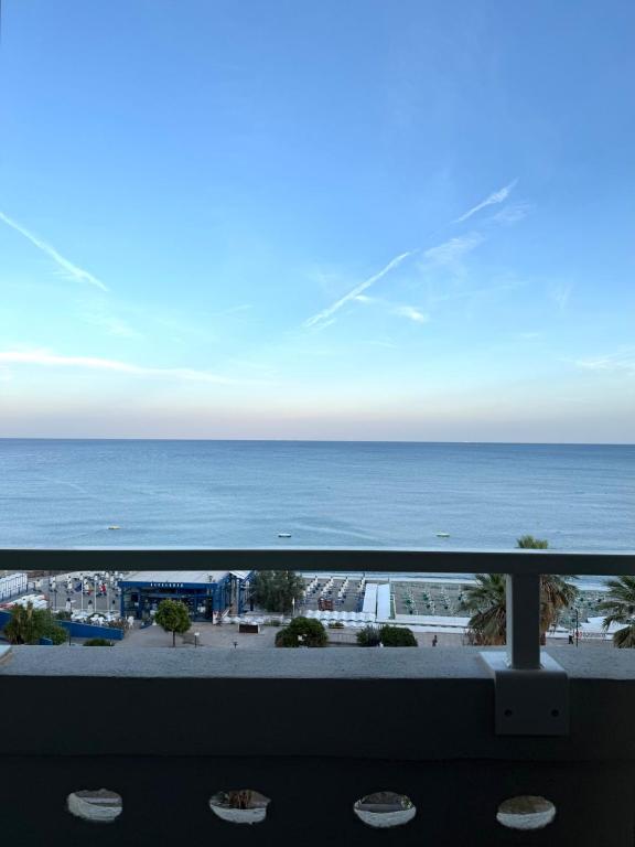 a view of the ocean from a balcony at La Finestra sul Blu - Sea View in Savona
