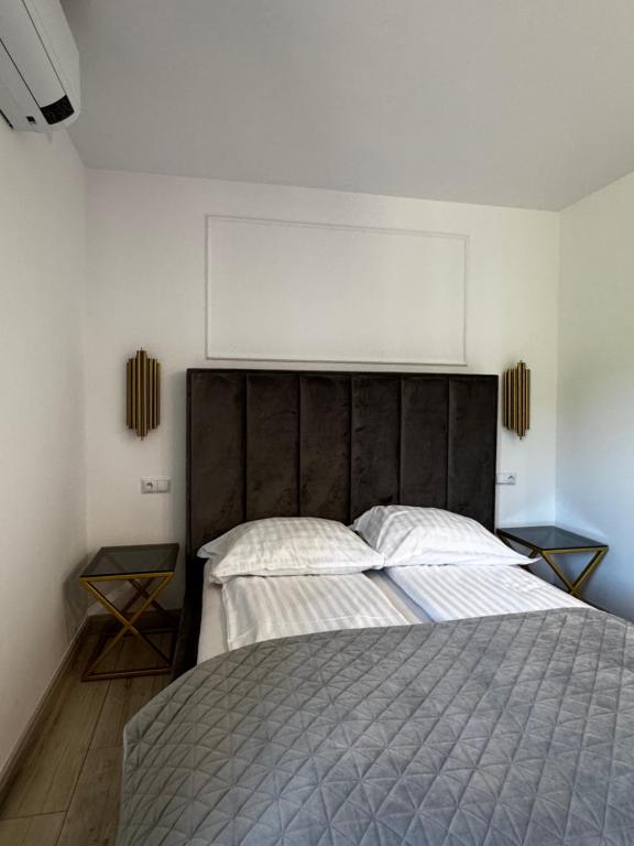 Posteľ alebo postele v izbe v ubytovaní Apartamenty
