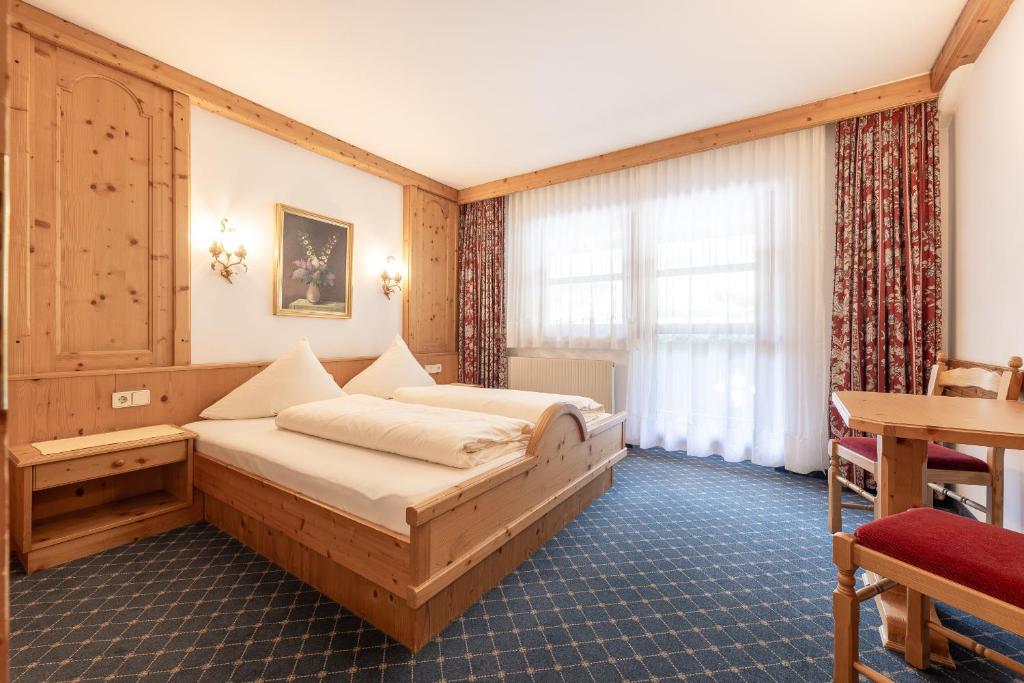 Posteľ alebo postele v izbe v ubytovaní Aparthaus Camping Stubai