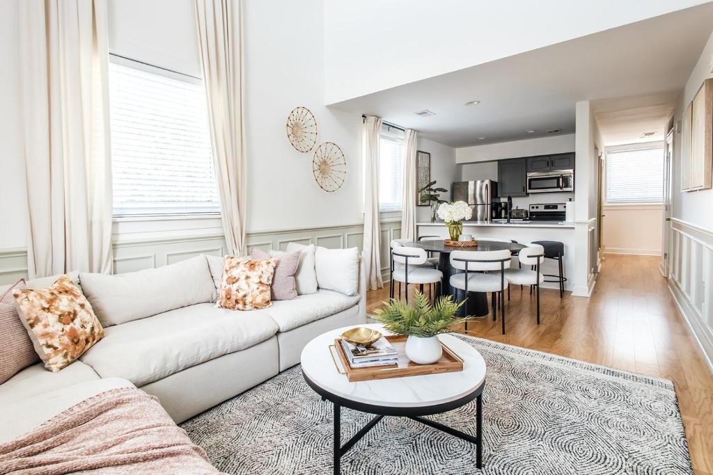 a living room with a couch and a table at 360 King in Charleston