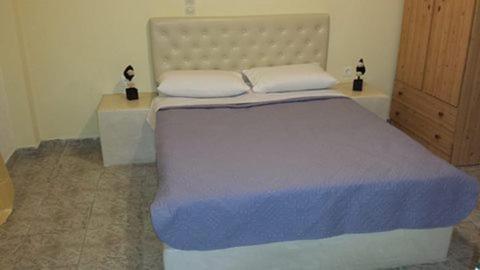 Una cama o camas en una habitación de Studio Mary
