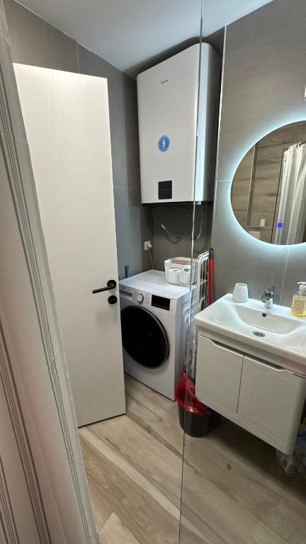 Postel nebo postele na pokoji v ubytování Kaneo Central Apartments