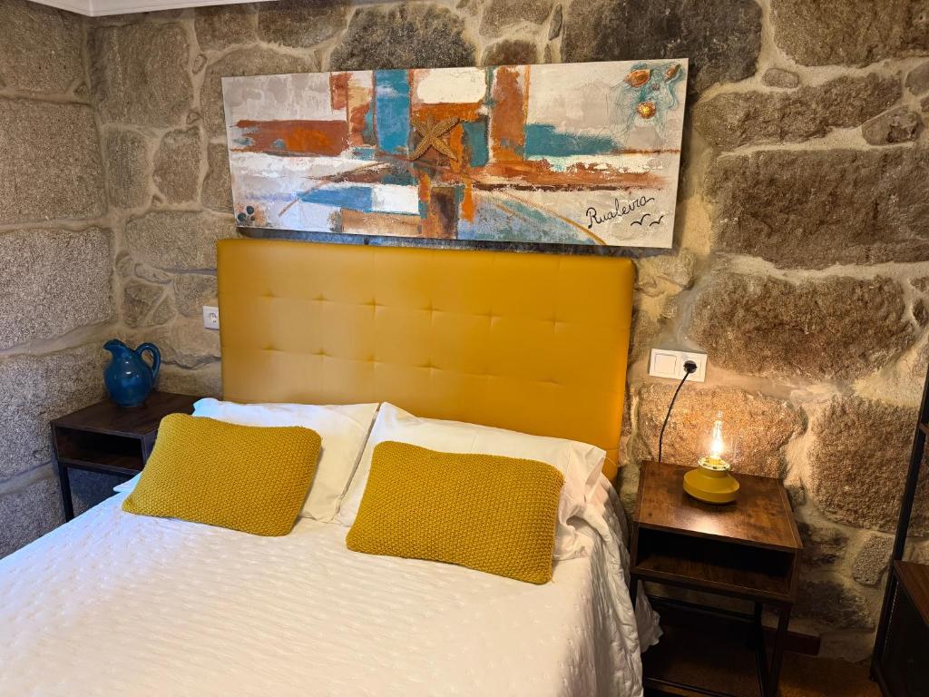 Postel nebo postele na pokoji v ubytování Casa Rualeira