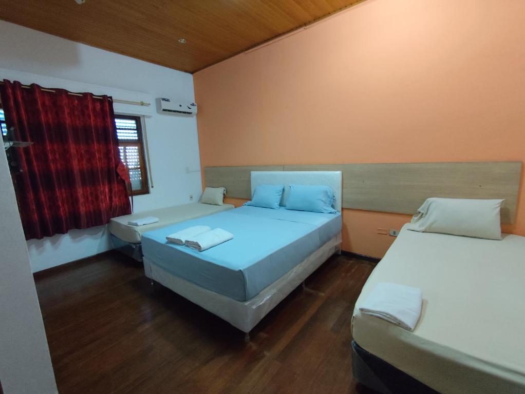 Letto o letti in una camera di CEDE Inn Hotel