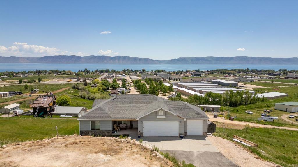 a house on a hill with a view of a town at Sail Boat Manor in Garden City