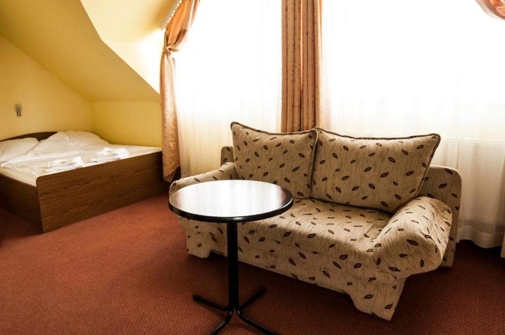 Postel nebo postele na pokoji v ubytování Hotel Oleńka