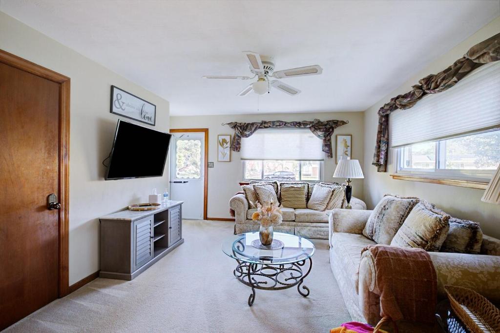 a living room with a couch and a table at Bayshore Breeze Hampton-Buckroe Long Term Stay in Hampton