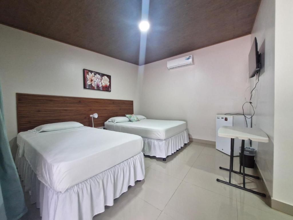 Postel nebo postele na pokoji v ubytování Hotel Carlota Tamarindo