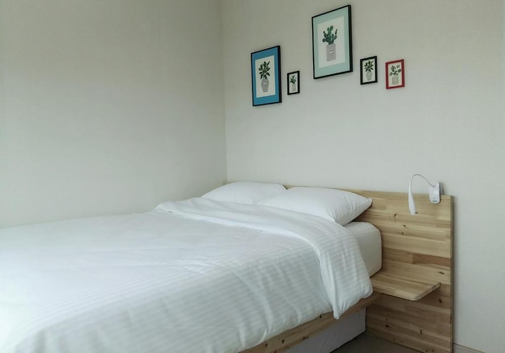 Postel nebo postele na pokoji v ubytování Bae Bae Guesthouse