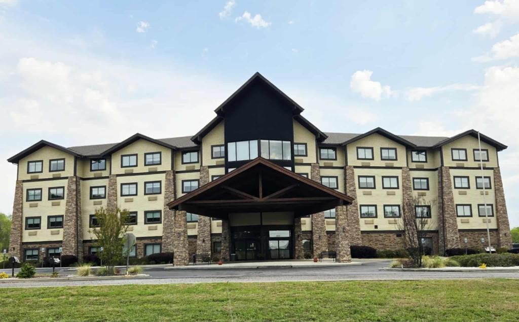 a large building with a black roof at Comfort Inn & Suites Near Lake Guntersville in Scottsboro