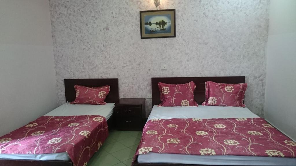 Postel nebo postele na pokoji v ubytování Hai Duong Guesthouse