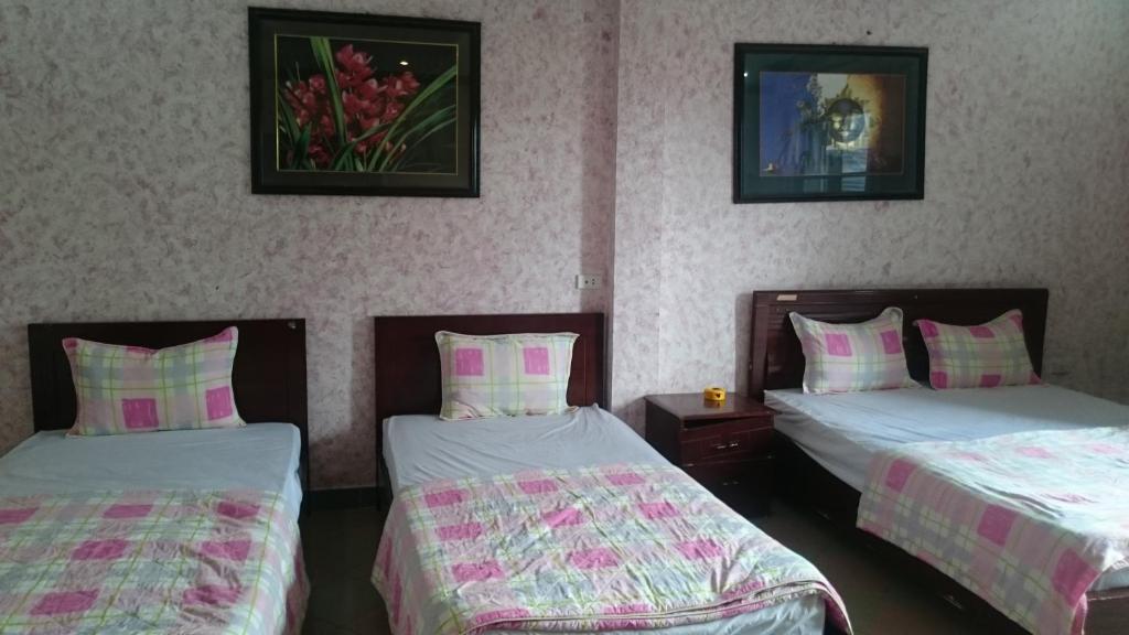 Postel nebo postele na pokoji v ubytování Hai Duong Guesthouse