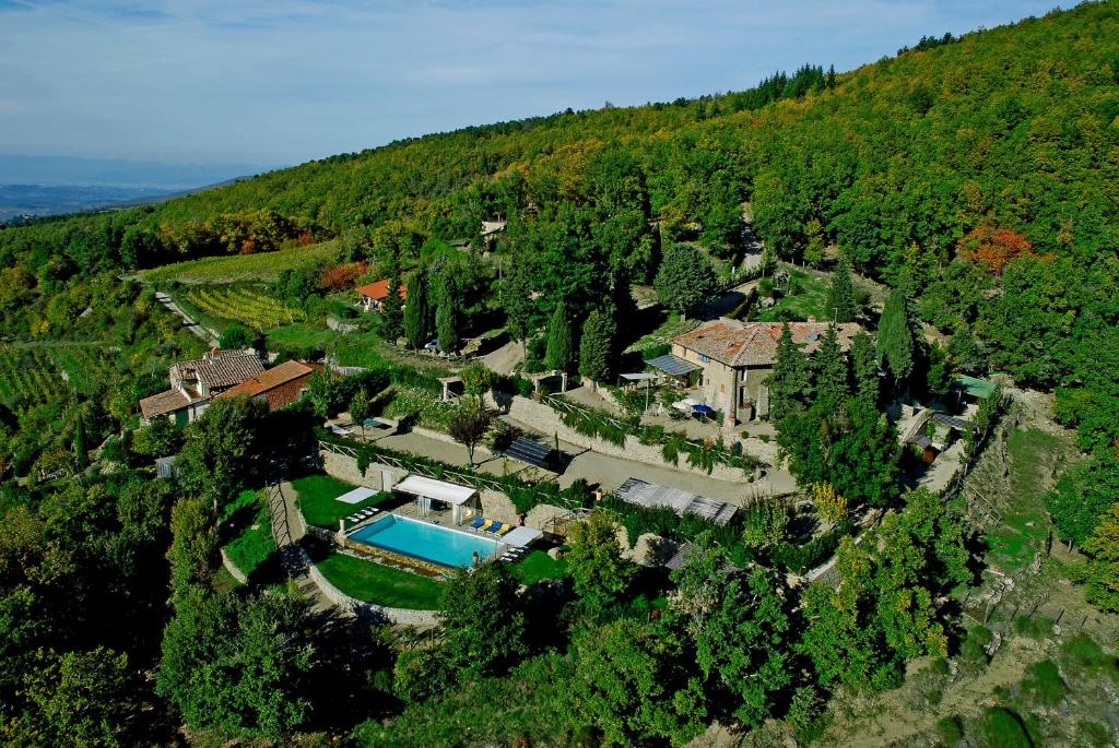 an aerial view of a house with a swimming pool at Rifugium in Greve in Chianti