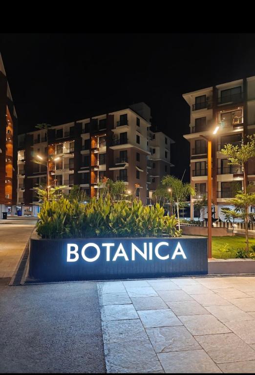 a sign in front of a building at night at Skylands Homes in Calangute