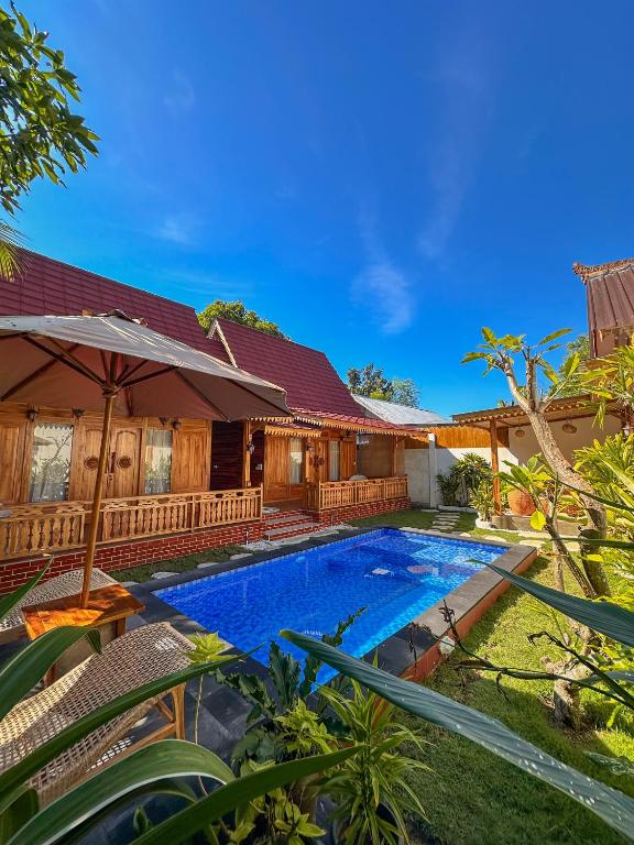 an image of a house with a swimming pool at Dunya Villa in Gili Islands