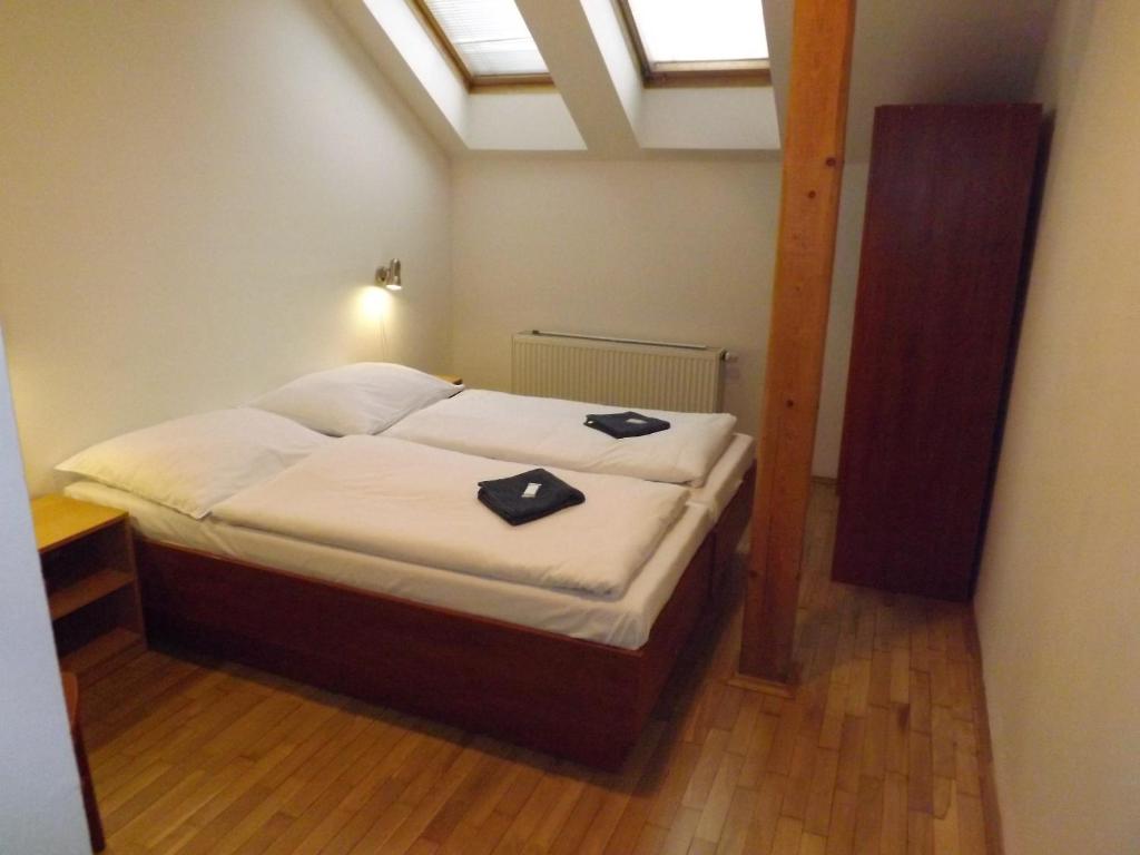 Postel nebo postele na pokoji v ubytování Beta Pension