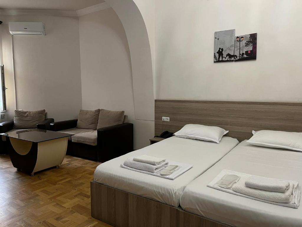 Postel nebo postele na pokoji v ubytování Olive hotel