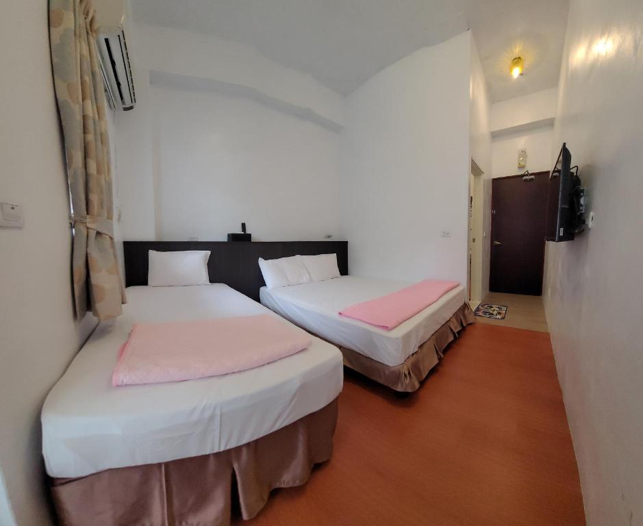 Postel nebo postele na pokoji v ubytování Lanyu Gulu Homestay