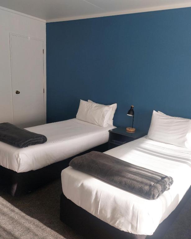 Postel nebo postele na pokoji v ubytování Lake Dunstan Motel