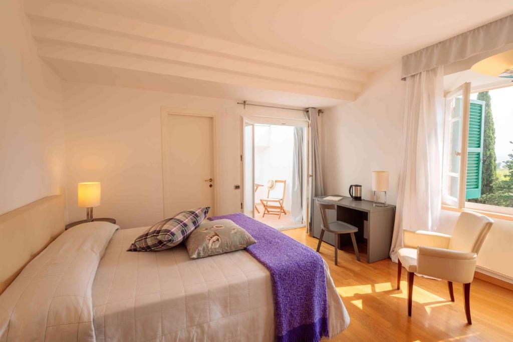 Łóżko lub łóżka w pokoju w obiekcie Relais Villa Sant'Isidoro