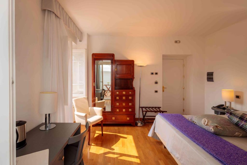Łóżko lub łóżka w pokoju w obiekcie Relais Villa Sant'Isidoro
