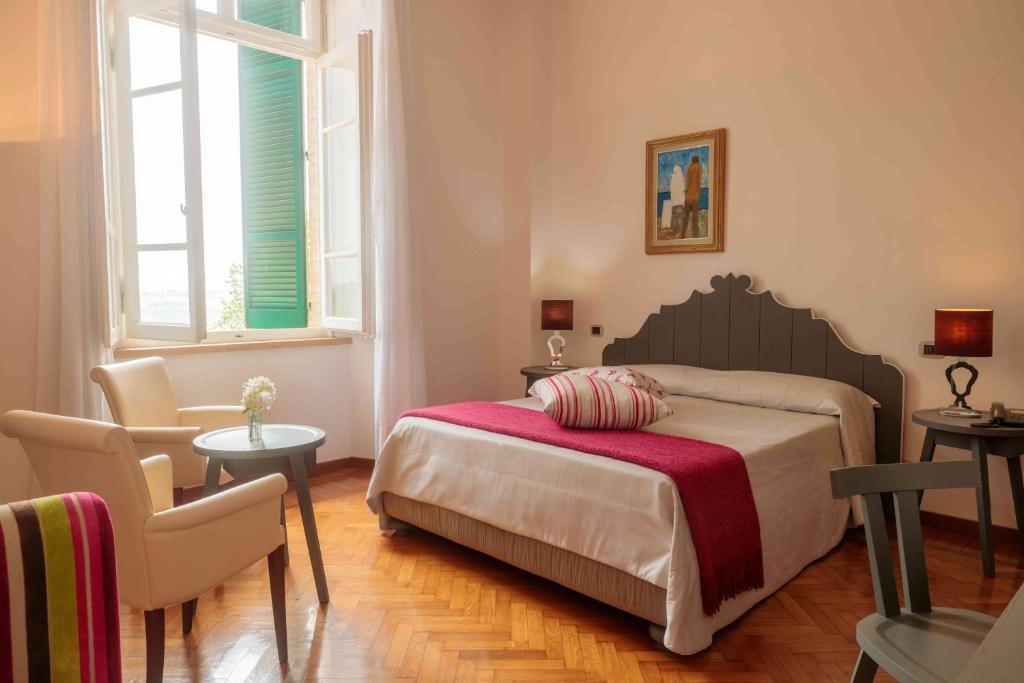 Łóżko lub łóżka w pokoju w obiekcie Relais Villa Sant'Isidoro