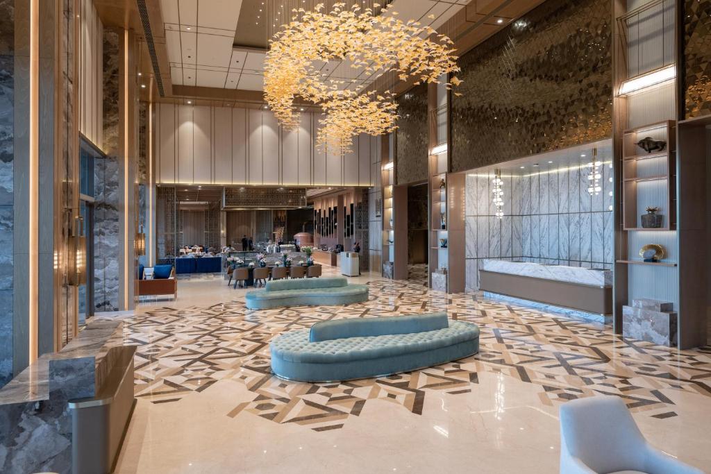 Posezení v ubytování Merlis Hotel Coimbatore